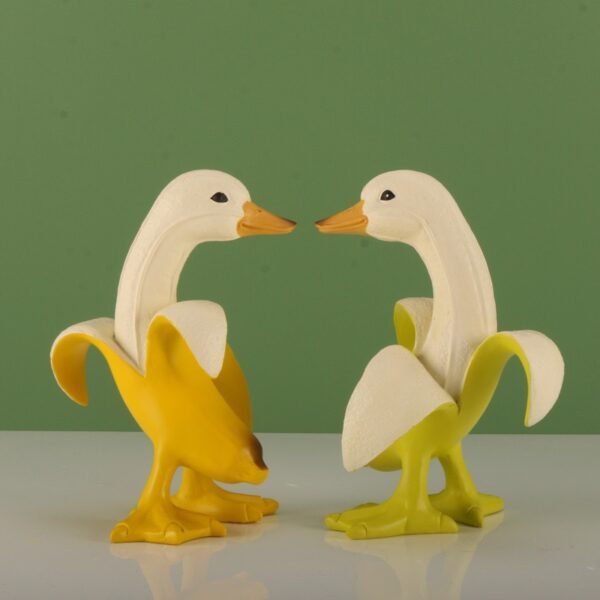 Yellow and lime green banana duck figurines